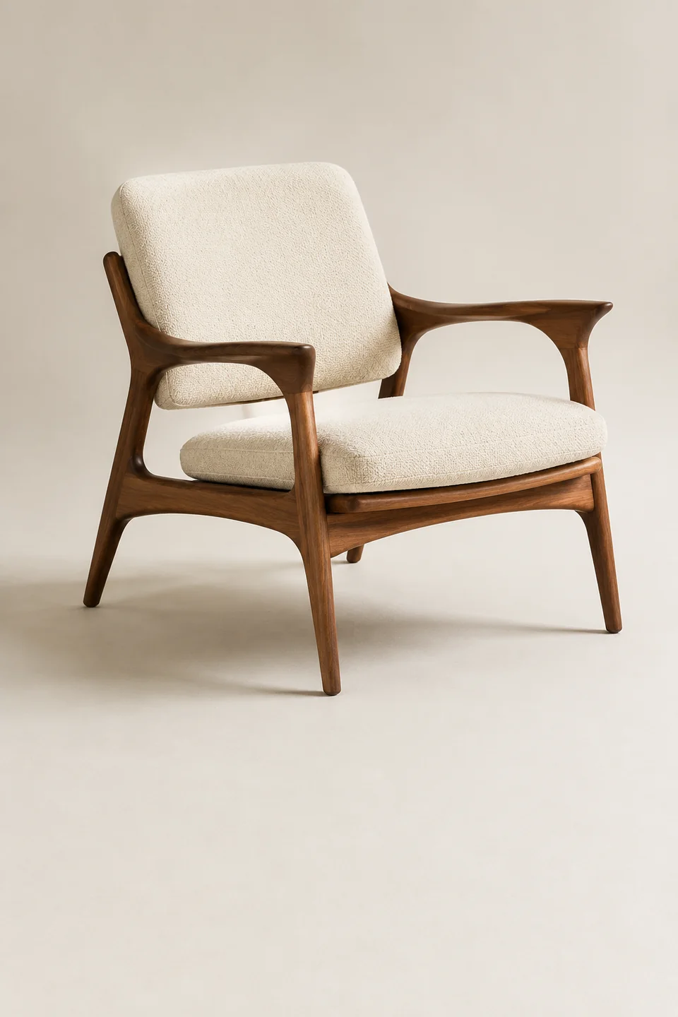 A complete walnut lounge chair against a clean neutral background